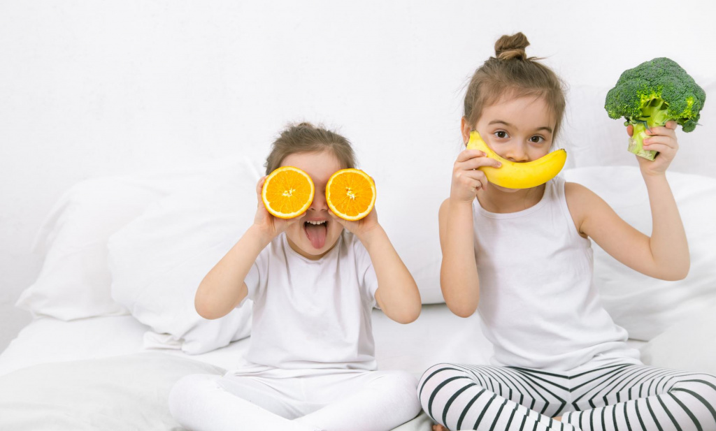 happy-two-cute-children-playing-with-fruits-vegetables (1).jpg