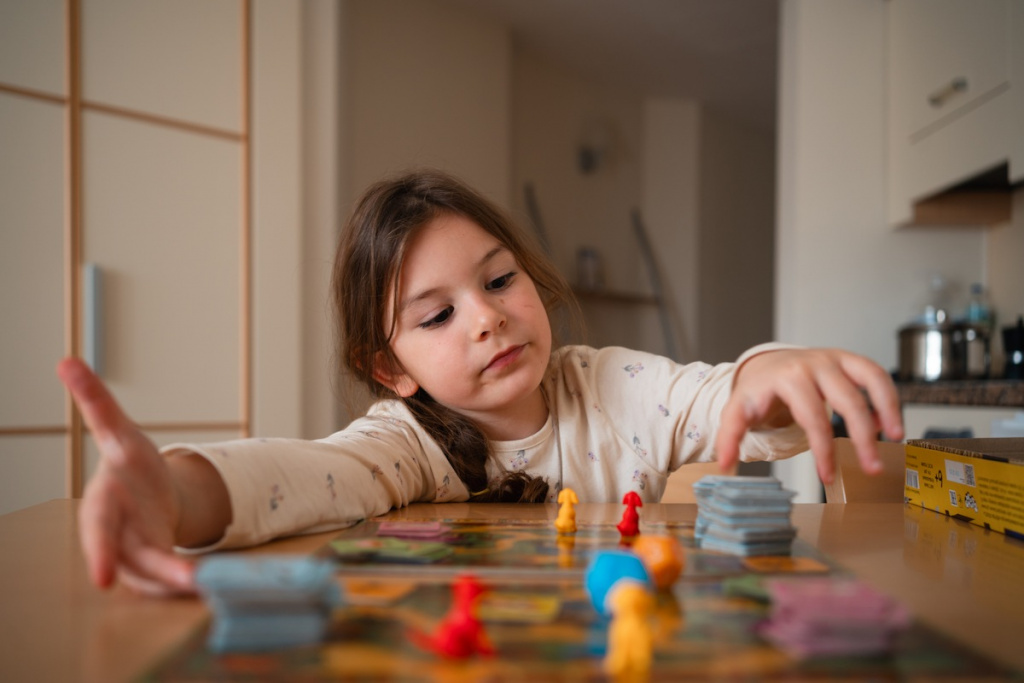 child-girl-playing-board-game-at-home-with-cards-a-2025-01-10-04-09-50-utc (1).jpg