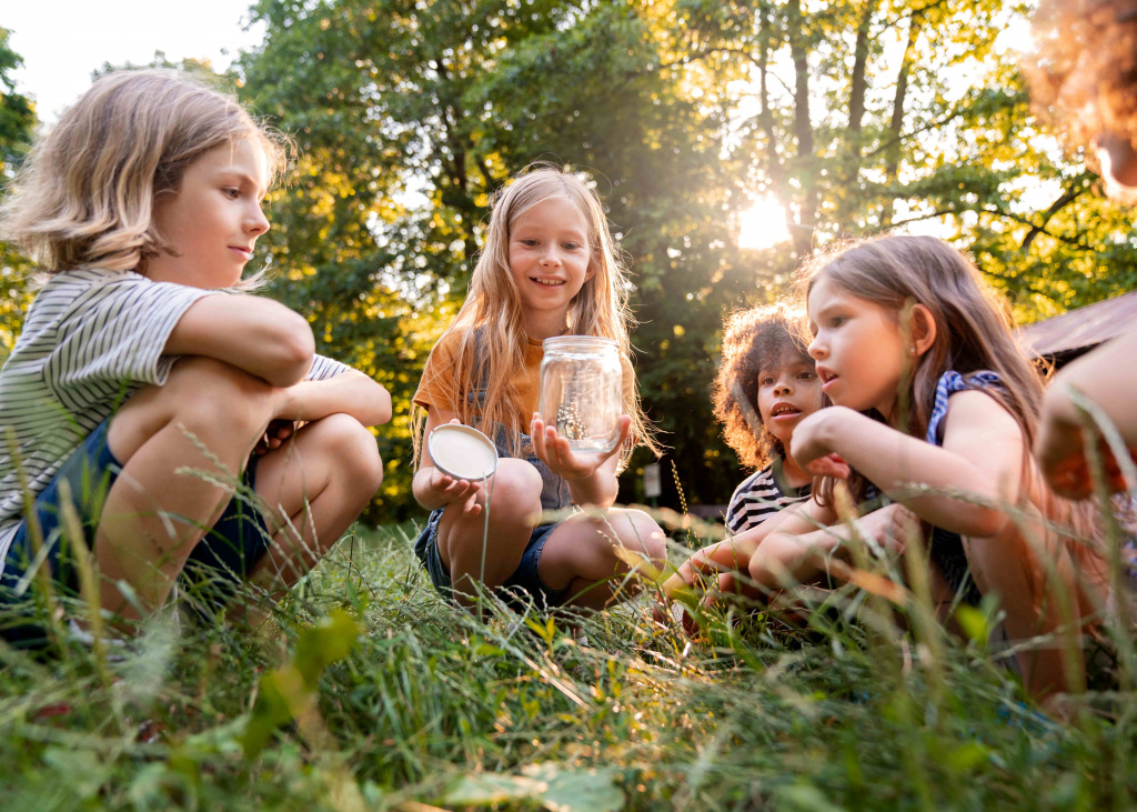 full-shot-kids-sitting-grass (1).jpg