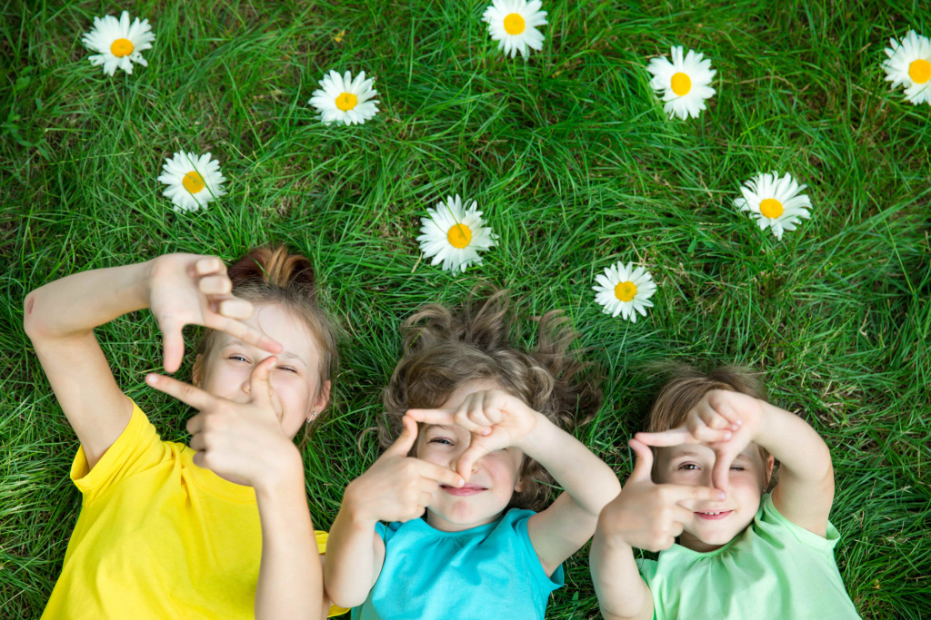 group-happy-children-playing-outdoors-kids-having-fun-spring-park-friends-lying-grass (1).jpg